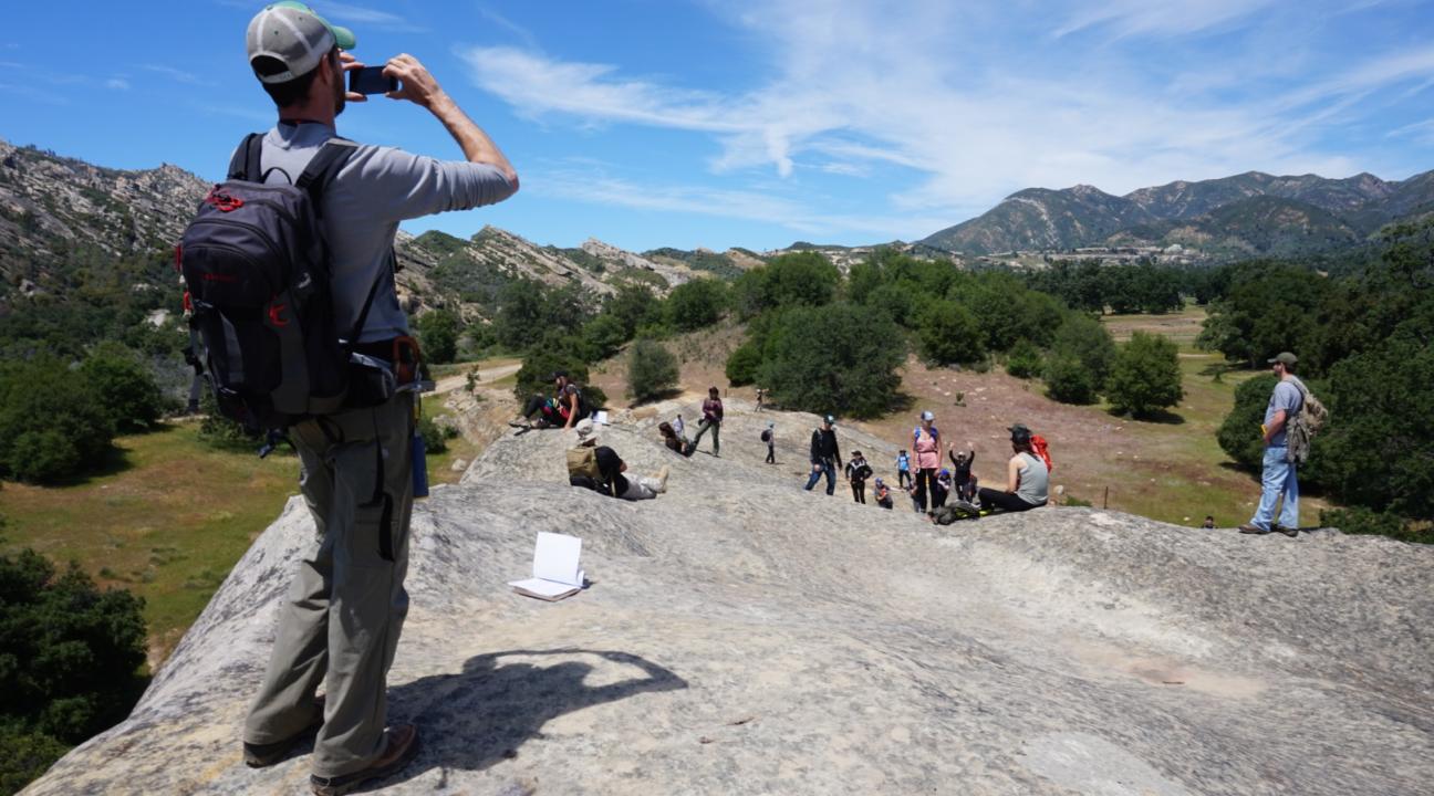 Owen taking a photo of the students
