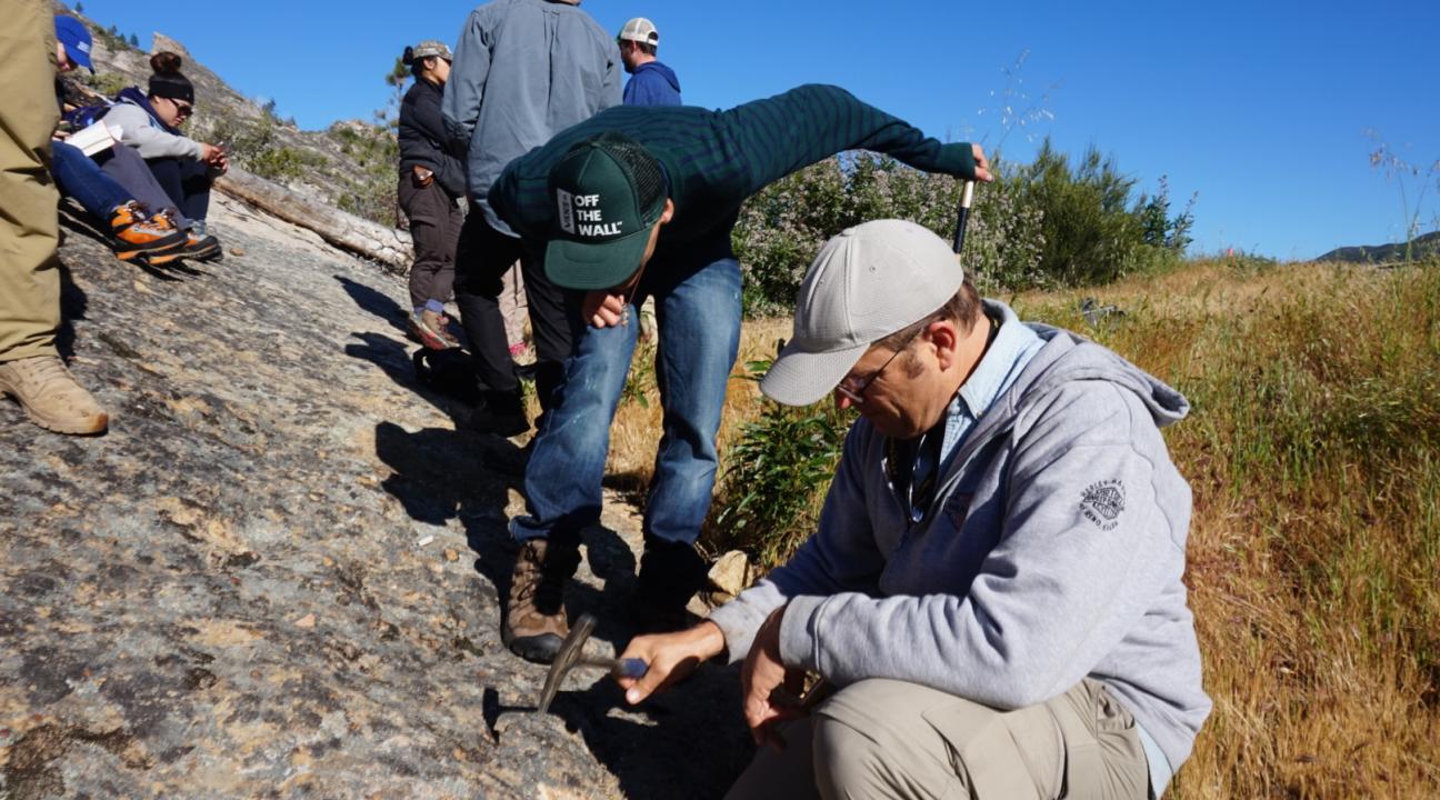 Students examining the sandstone