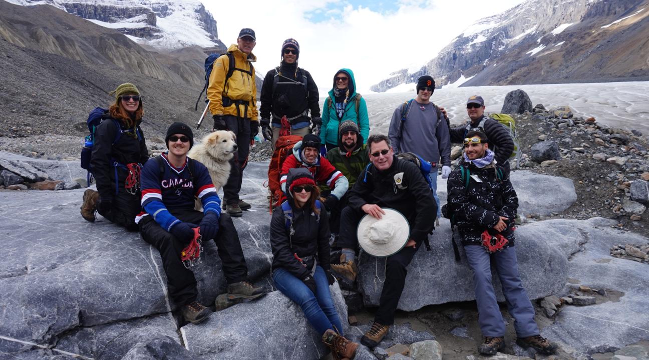 Class posing for photo on glacier