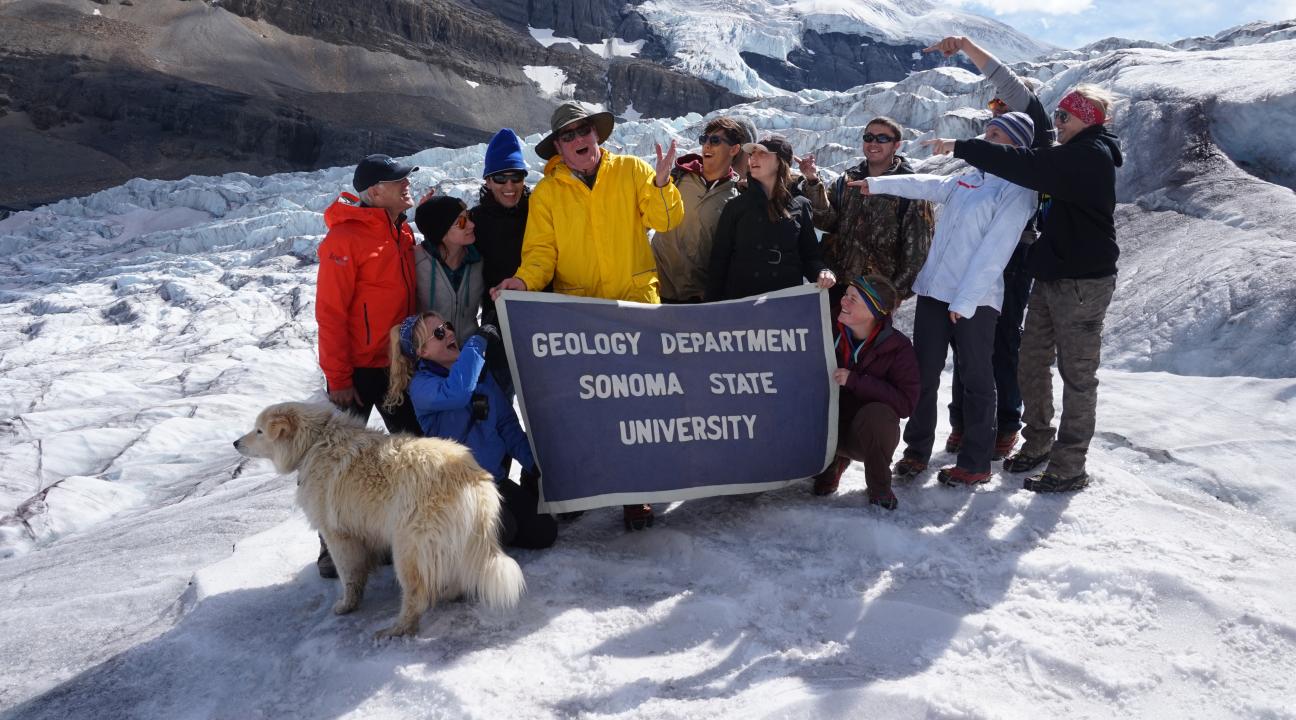 Student tasting clear glacial ice