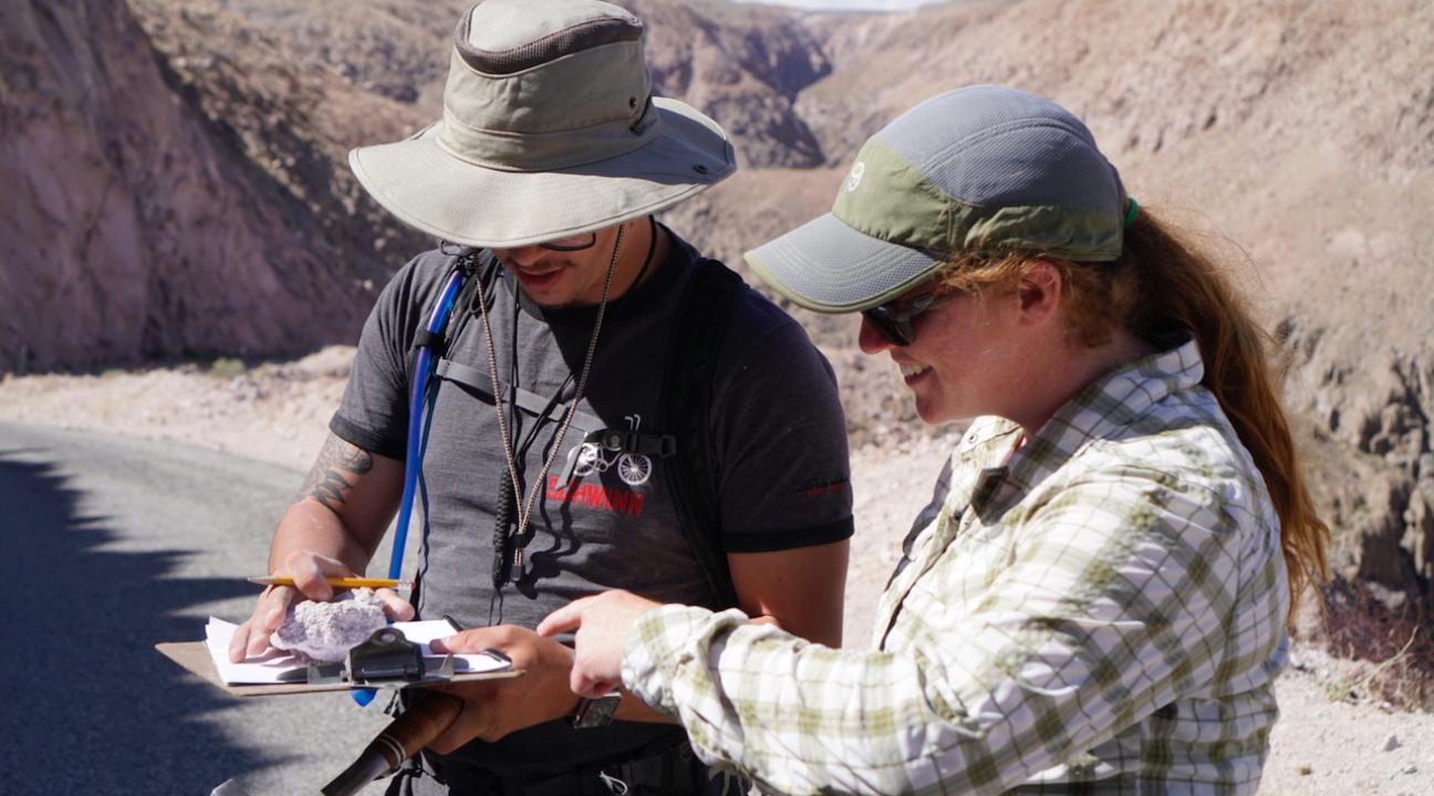 Student and faculty examining hand samples