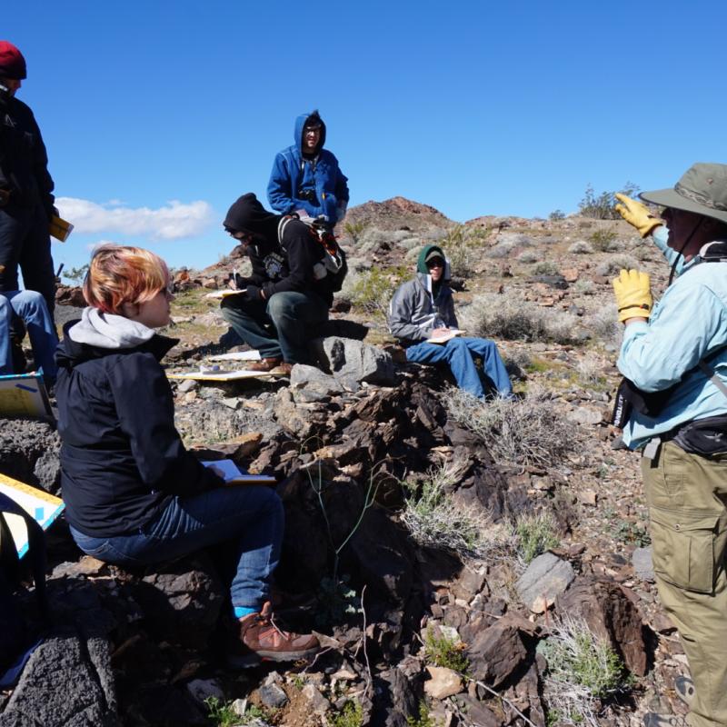 Students being instructed in the field