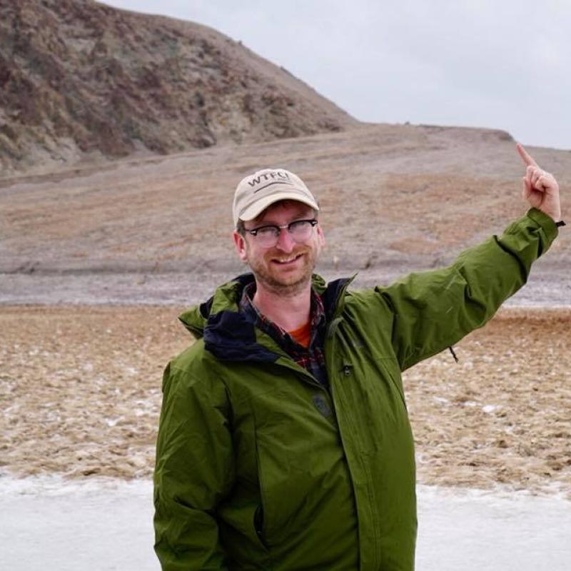 Matty pointing to fault scarp