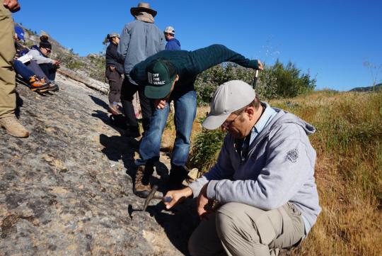 Students examining the sandstone