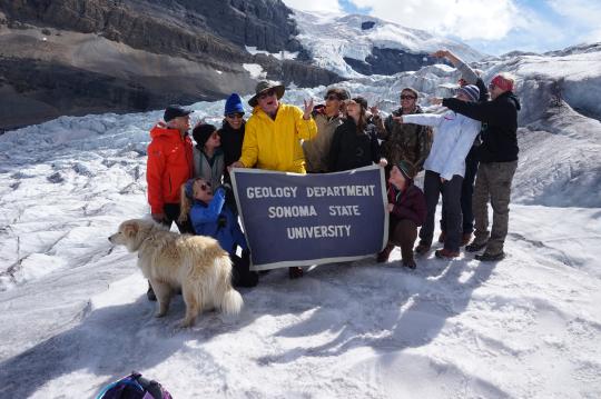 Student tasting clear glacial ice