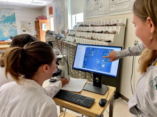 Students using the microscope camera